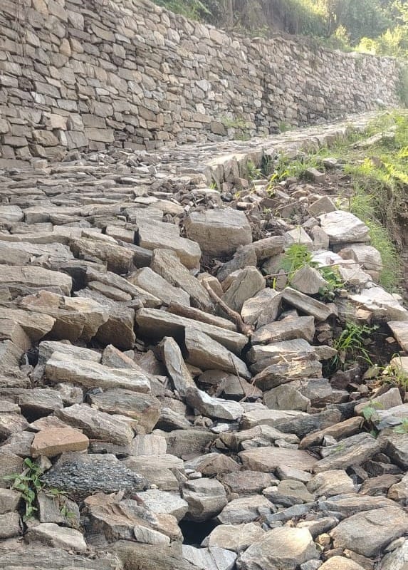 Roads damaged by rain and landslides; timely repair a major challenge.