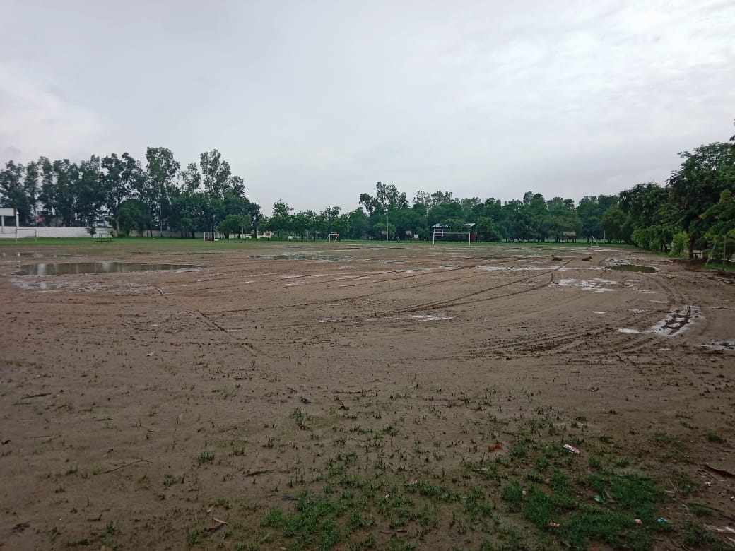 Players are facing difficulties due to rainwater accumulating on the sports field