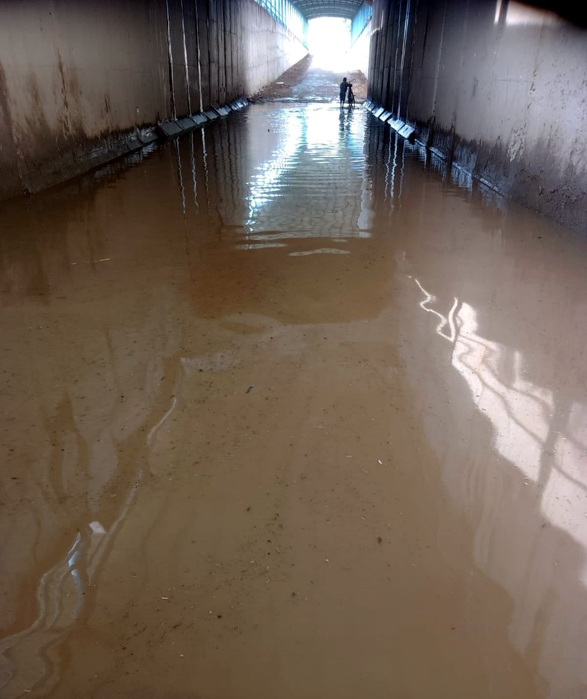 The underpass was filled with water, an elderly woman crossing the tracks was hit by a train and died.