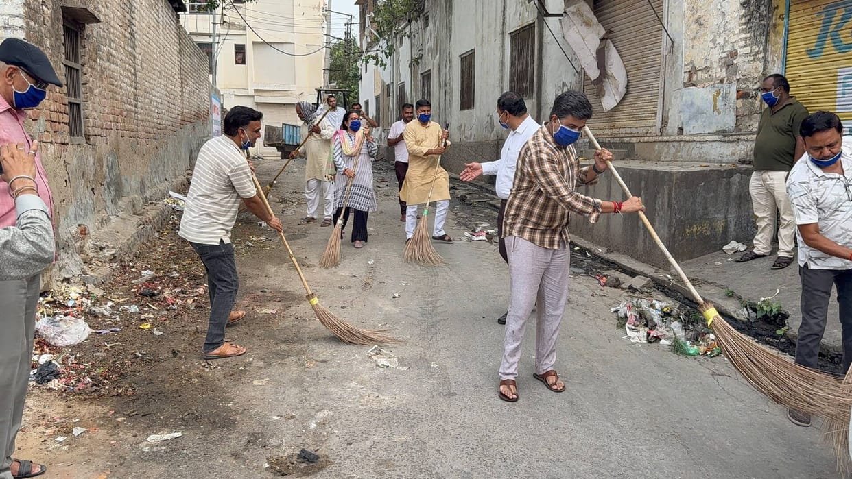 Conveyed a message of cleanliness by sweeping.