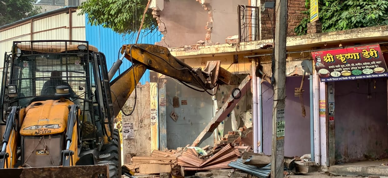 Bulldozer roars at TCI intersection; over 38 shops and houses demolished