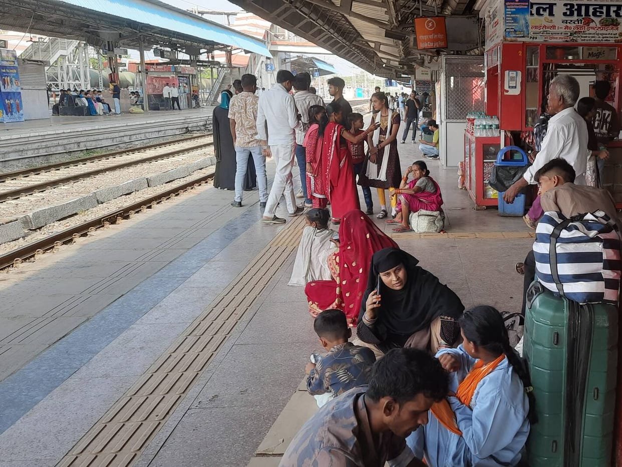 Trains running late; waiting turns the morning into evening.