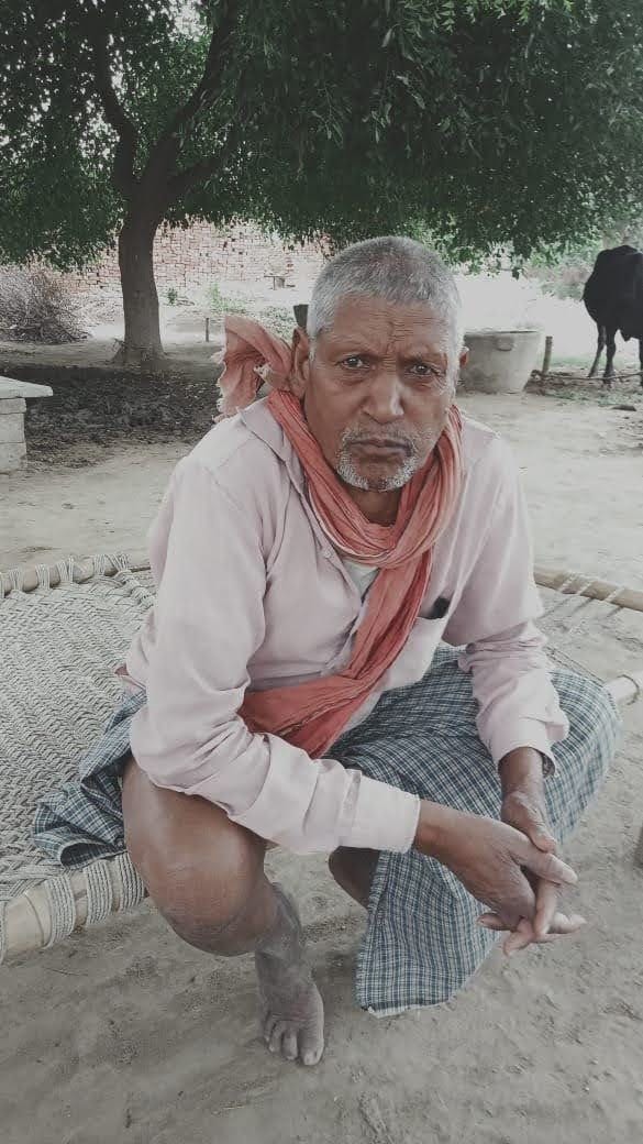 Elderly man standing by the roadside struck by a bike; dies.