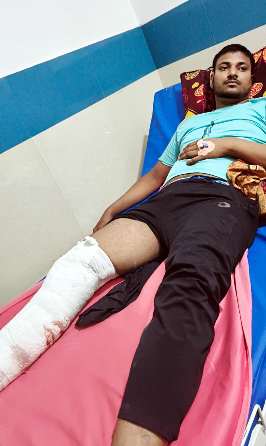 Youth walking on highway hit by bike, injured.
