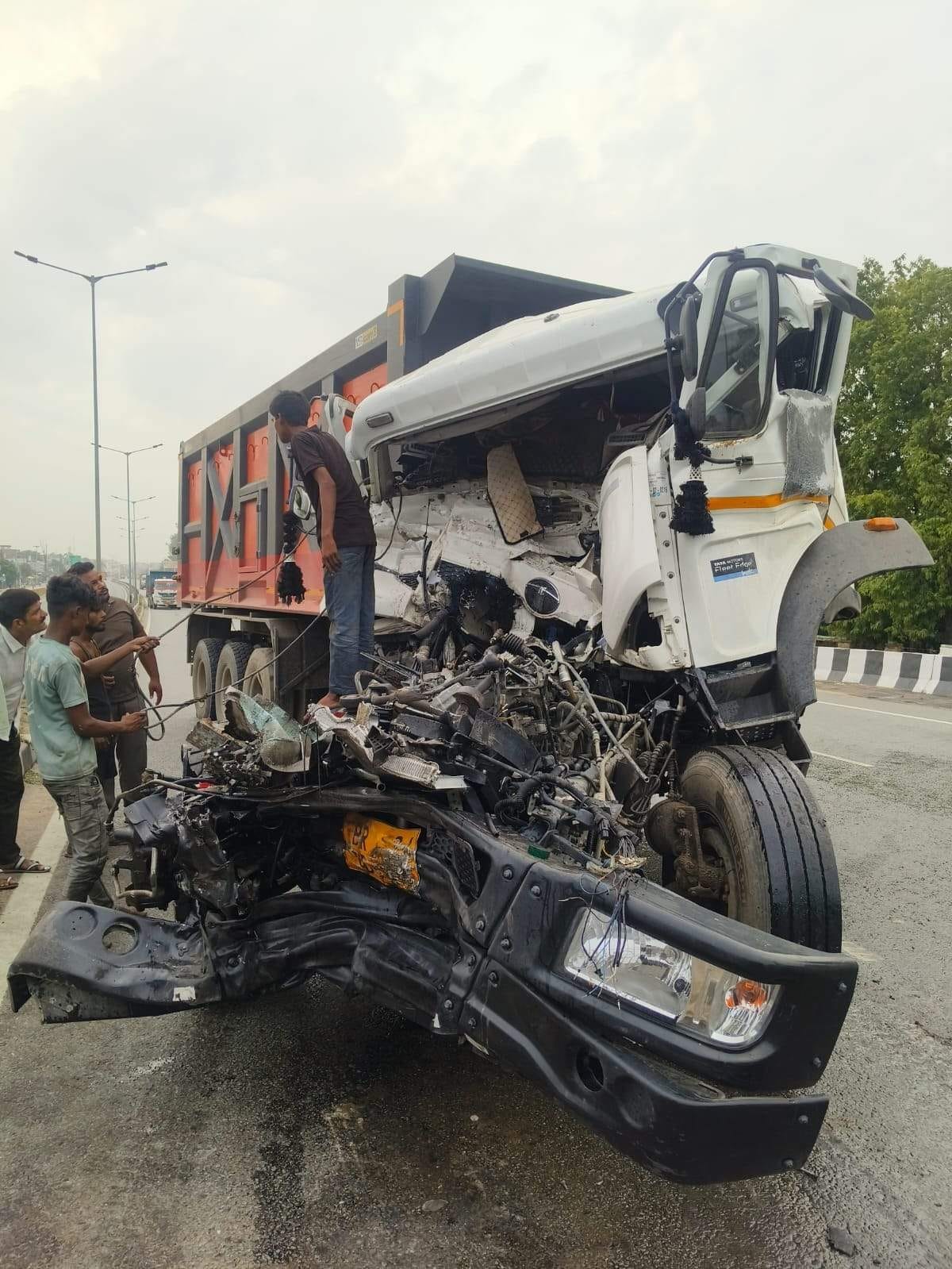 Speeding truck rams into parked trailer; driver dies.