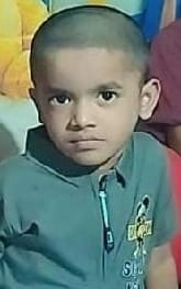 Car runs over innocent child playing outside home.