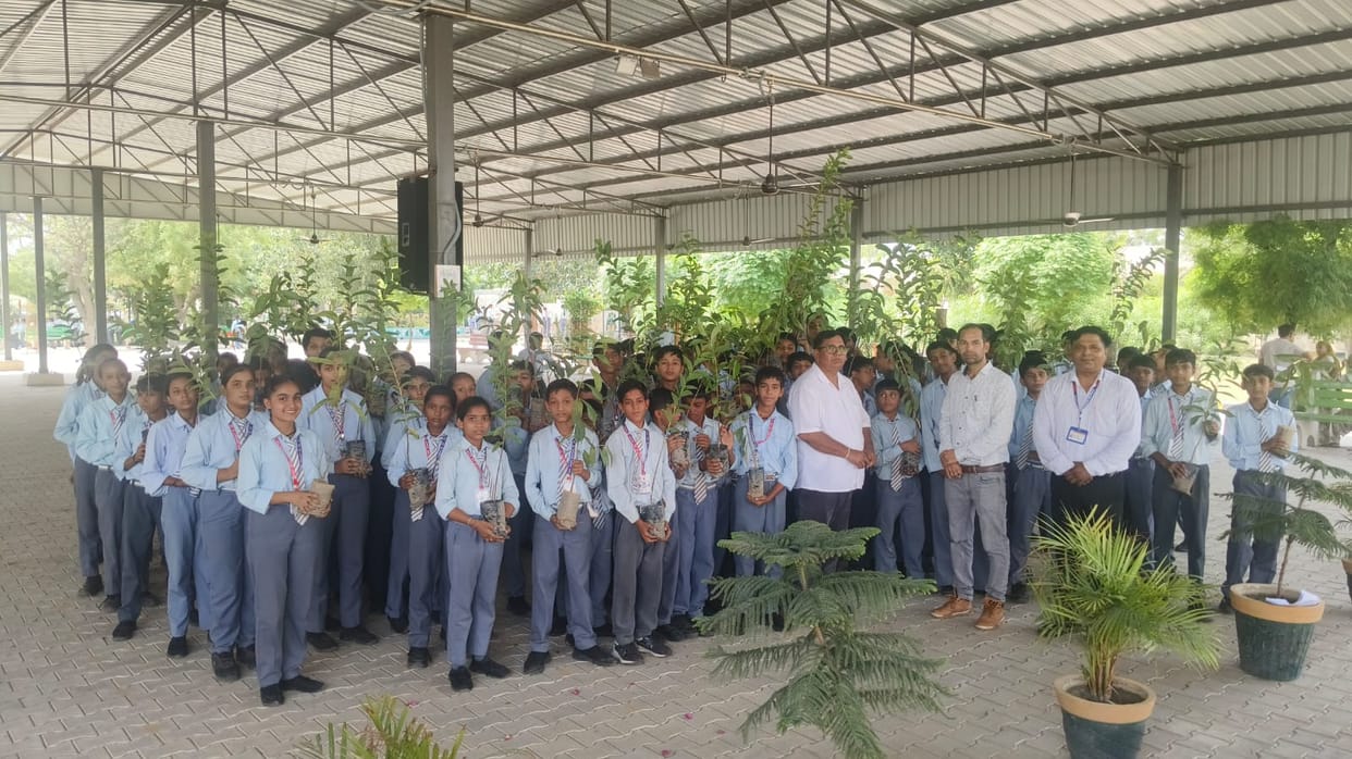 Students in the school gave the message of greenery by planting a tree in the name of their mother.