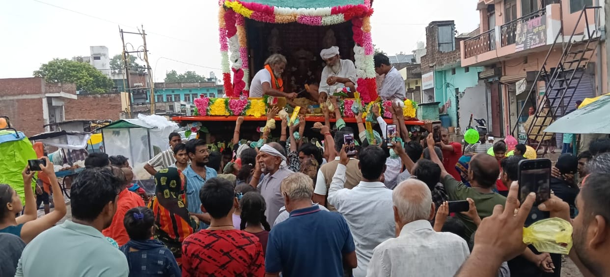 Devotees throng the Jagannath Rath Yatra and offer *Bhog*