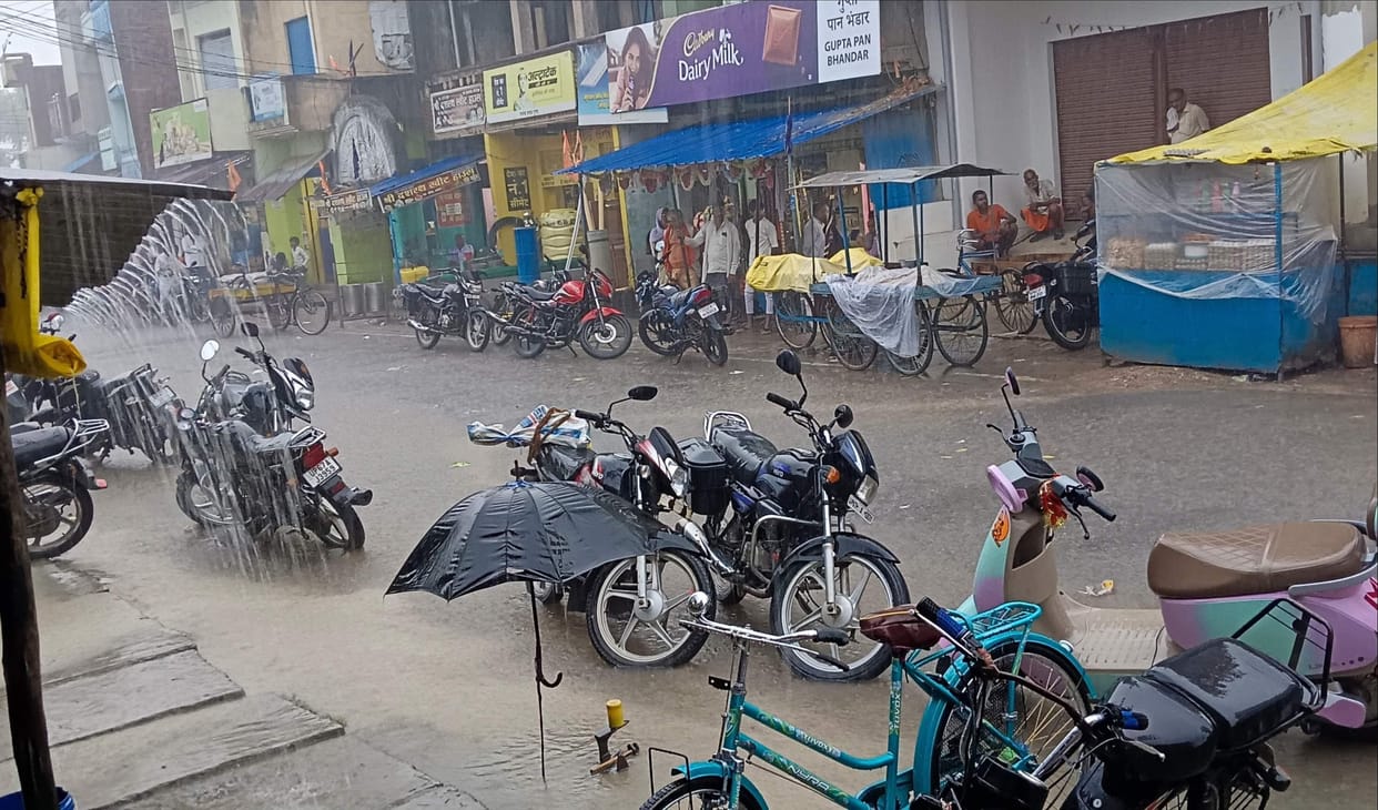 Relief from an hour of rain; farmers' faces light up with joy.