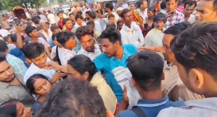 Married woman's body brought to village after post-mortem; commotion ensues.