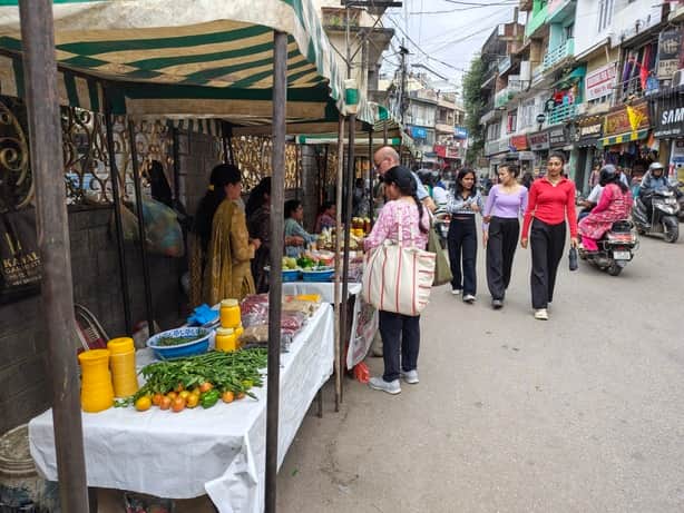 Women selling everything from local vegetables and homemade spices to *makki ki roti* (corn flatbread).