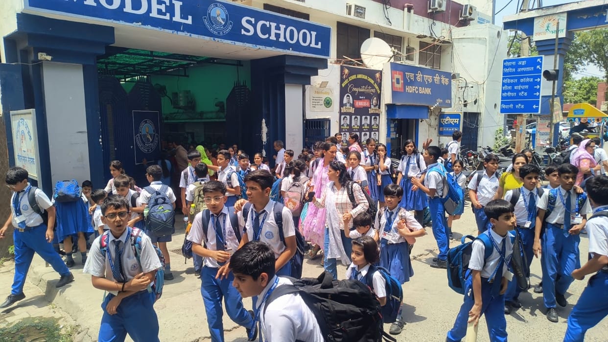 Threat received to blow up the municipal corporation and a school; premises evacuated in a rush.