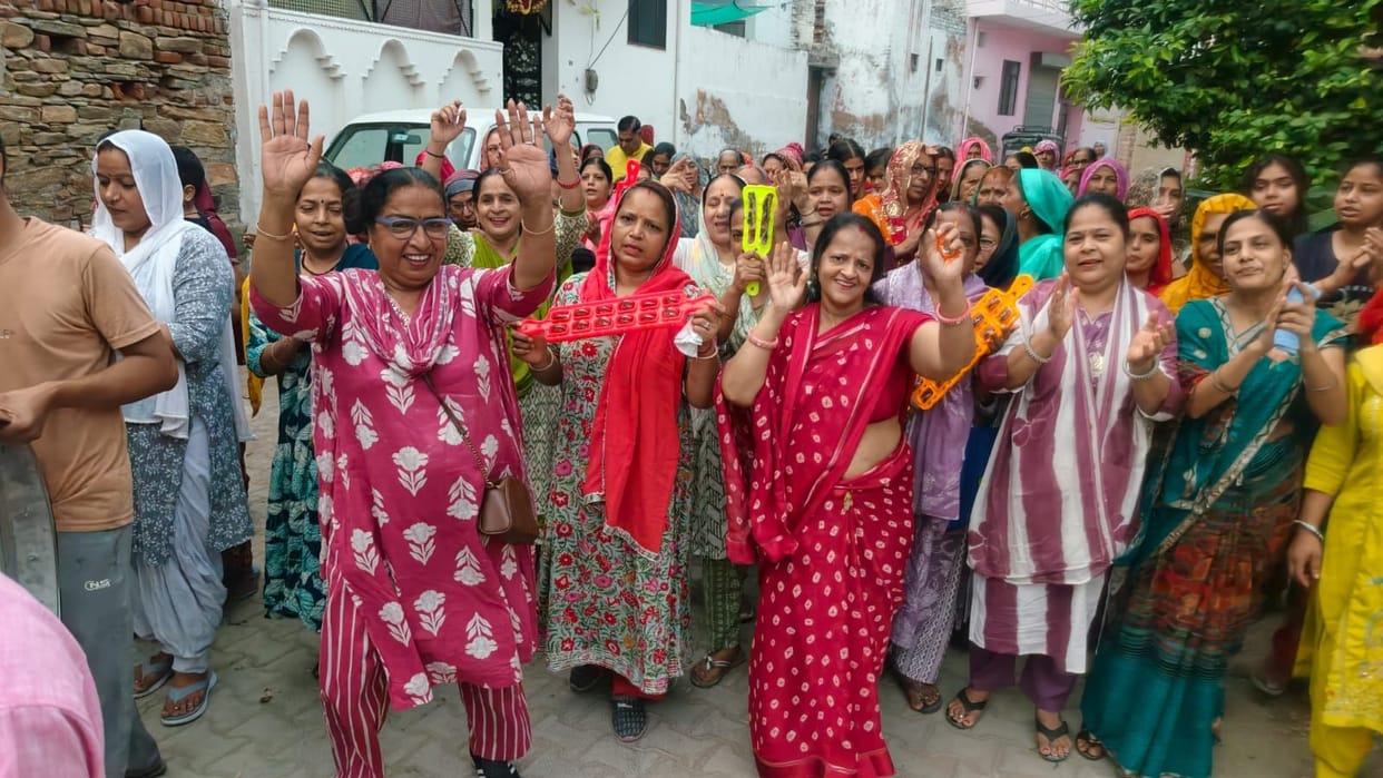 Chants of 'Radhe-Radhe' echoed during the morning procession.
