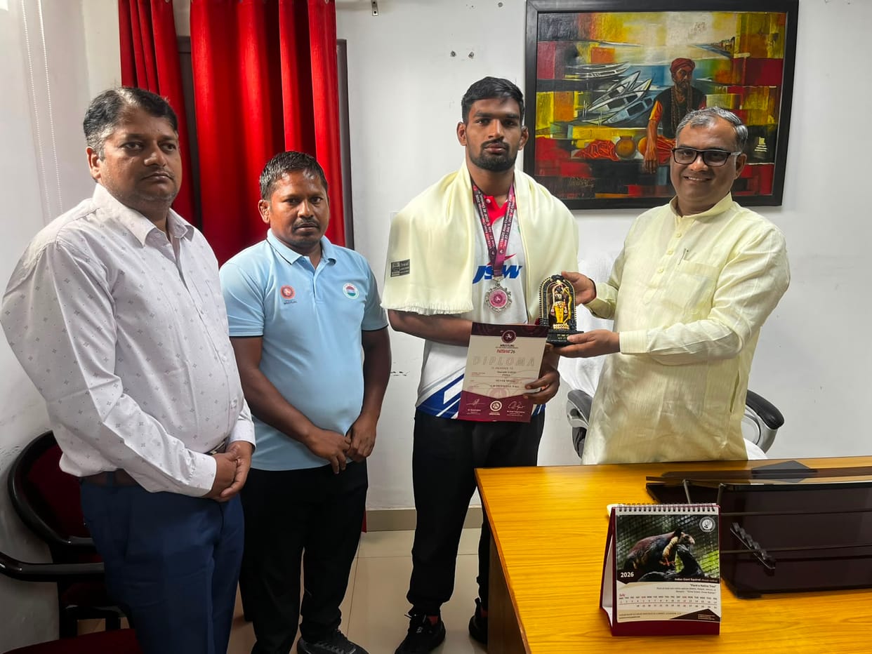 The minister felicitated Saurabh, who was selected for the World Wrestling Championships.