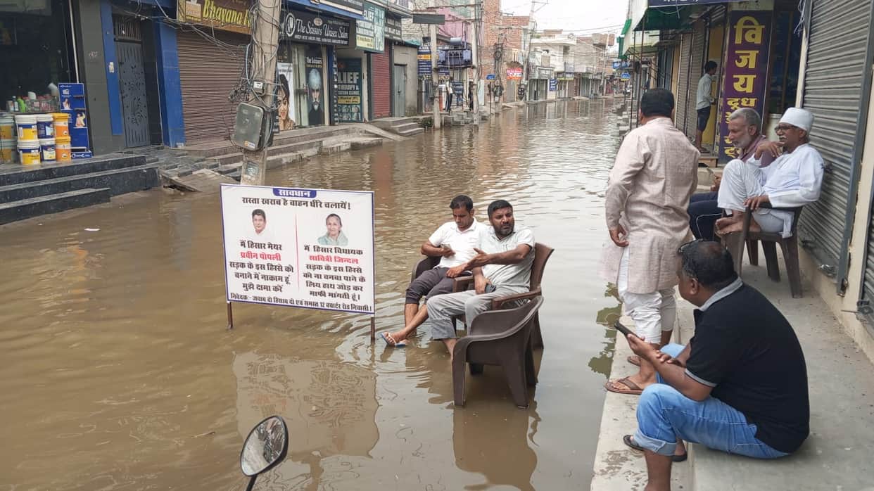 Politicians' photos in contaminated water; public anger soaring.