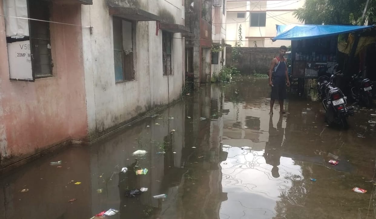 Water in front of houses in Kanshiram Colony, heaps of garbage everywhere