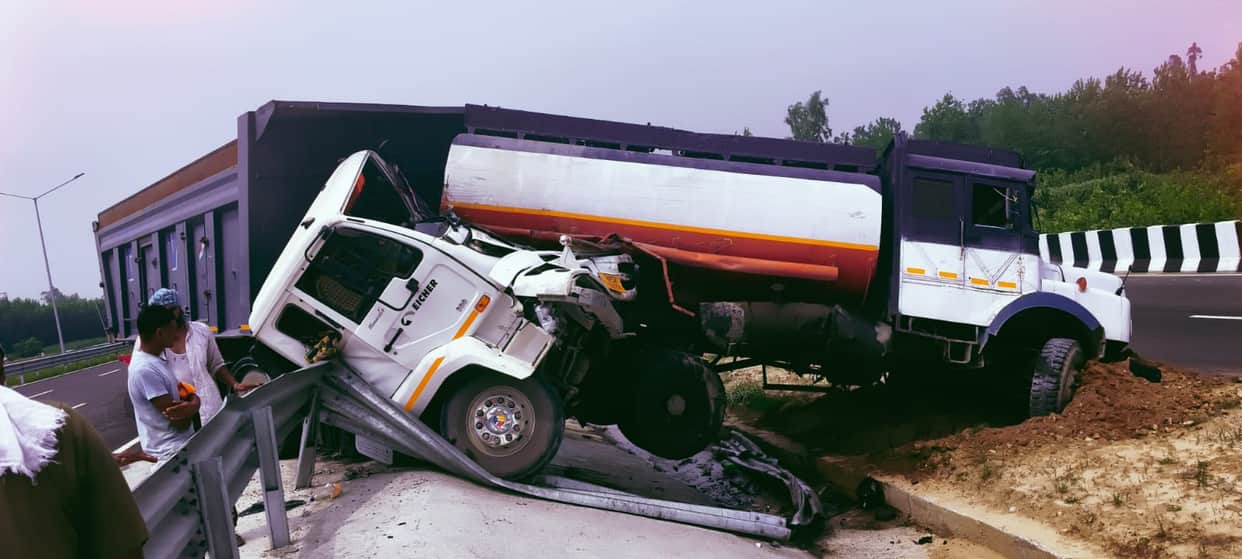 An uncontrolled trolley collided with an NHAI tanker after a tyre burst, injuring three.