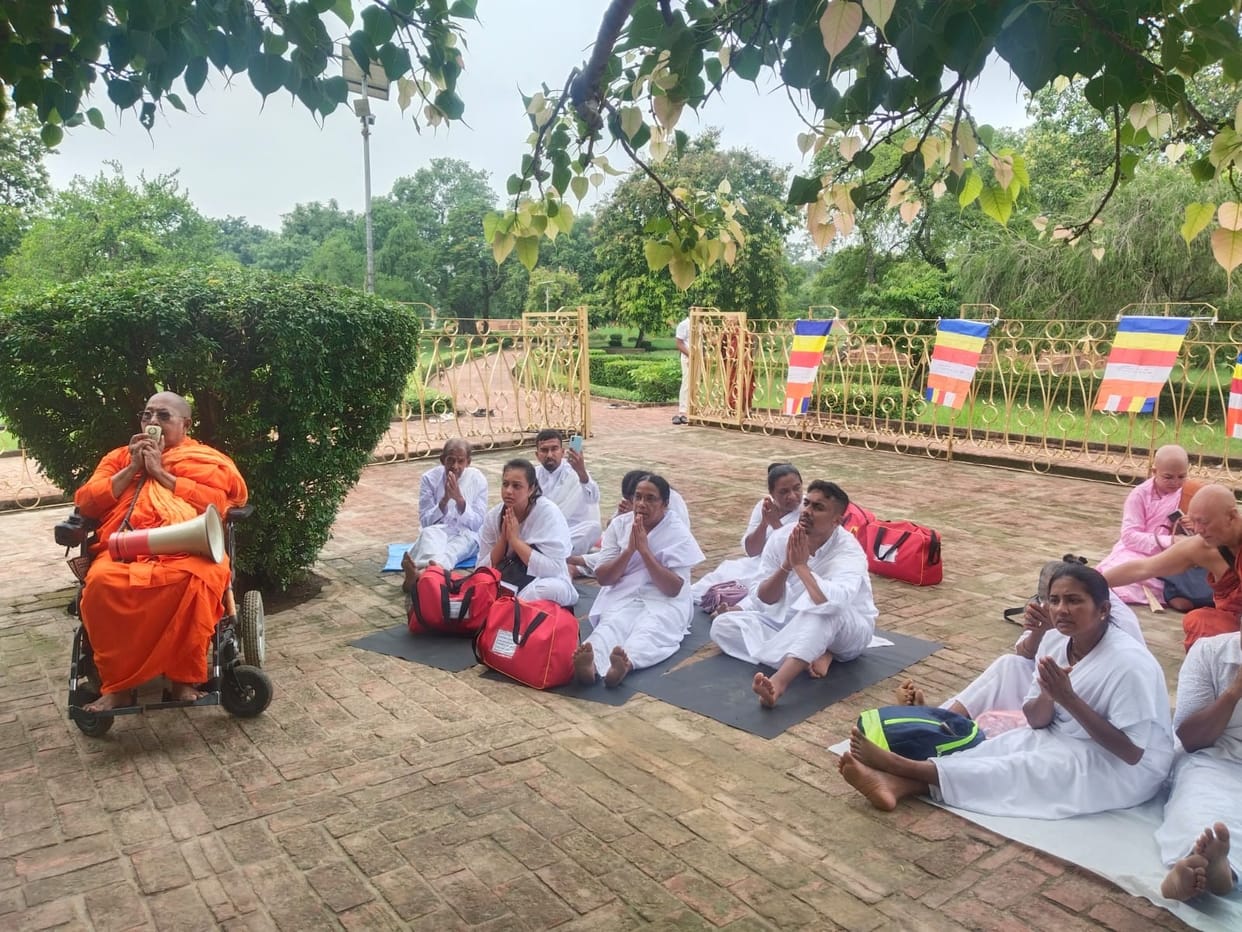Followers from Sri Lanka arrive at the Buddhist pilgrimage site.