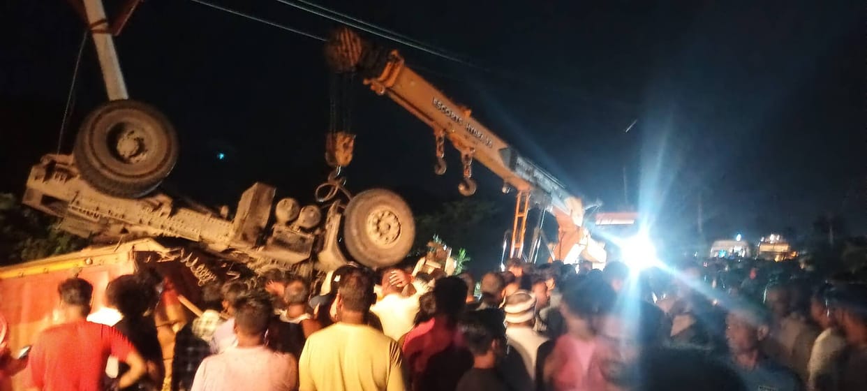 Wheat-laden truck overturns; driver crushed to death.