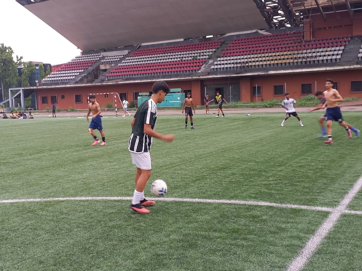 Players gather on the field for football training