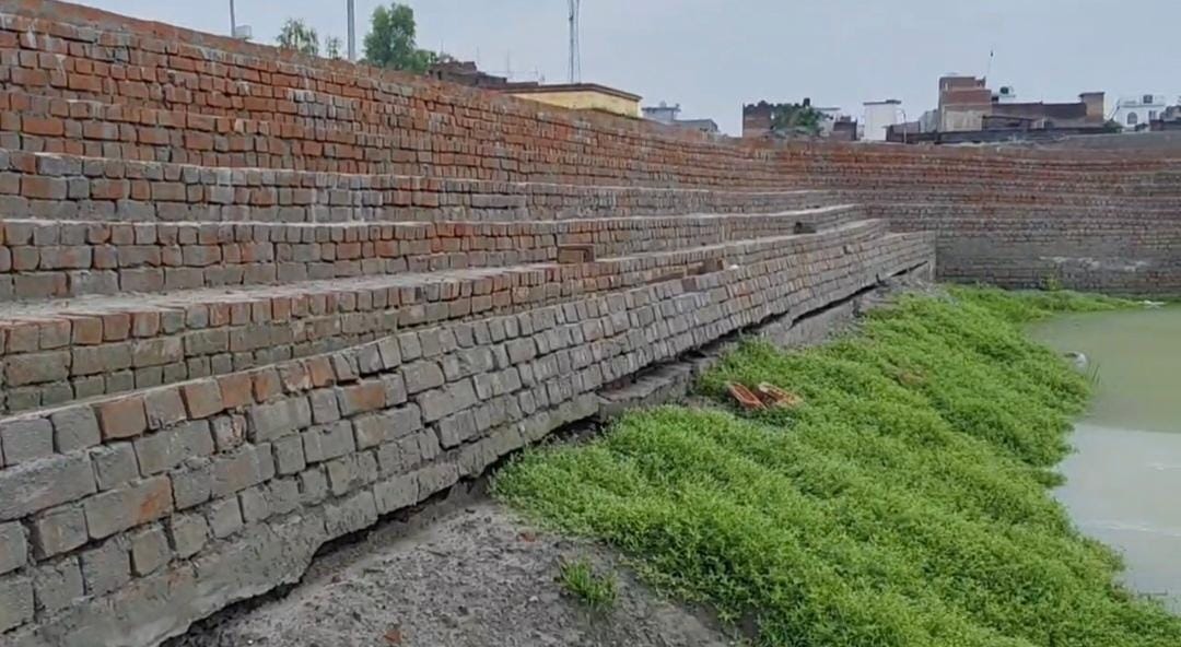 Cracks in the stairs of the under-construction Amrit Sarovar