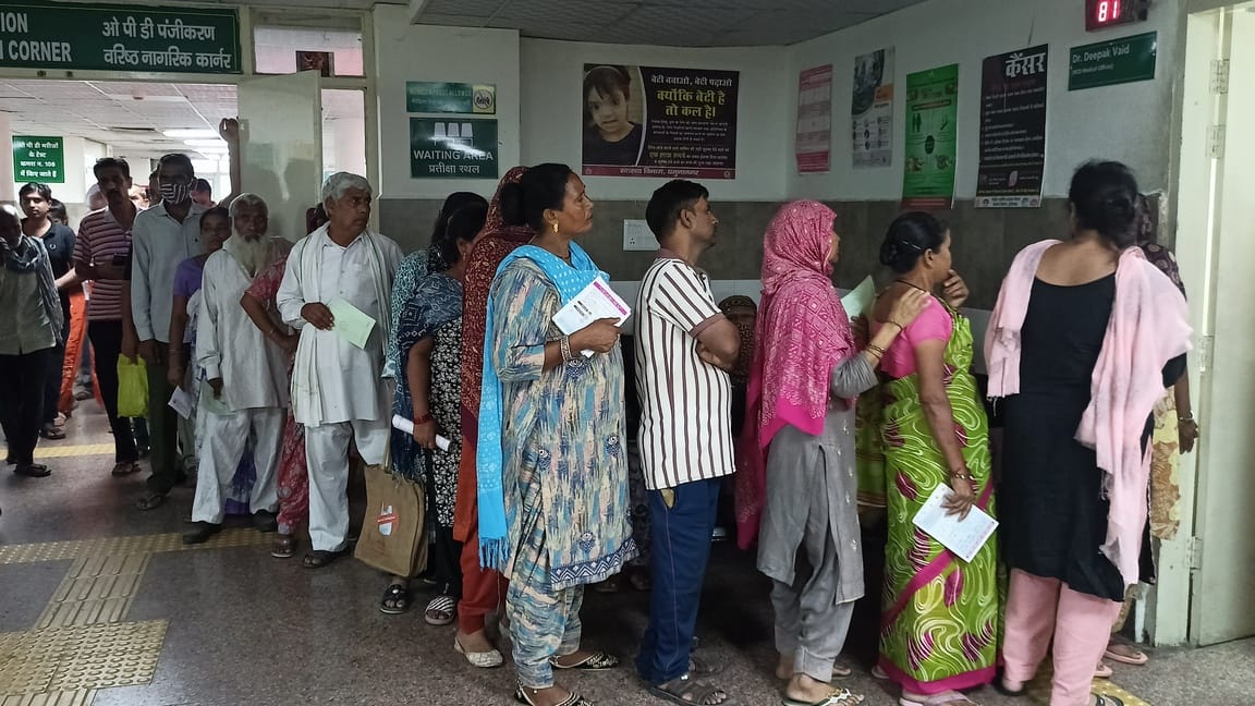 Vehicles lined the hospital road, and patients lined up inside