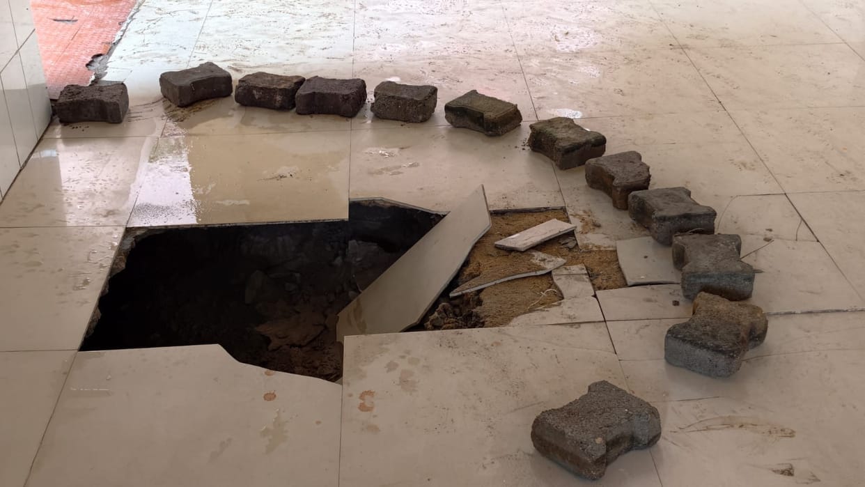 Emergency ward corridor caves in due to rain; 4-foot-deep pit formed.