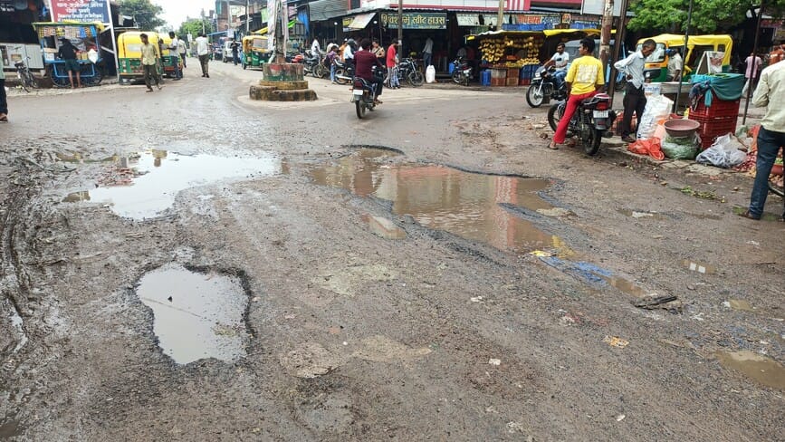 Even walking on the dilapidated road is difficult.