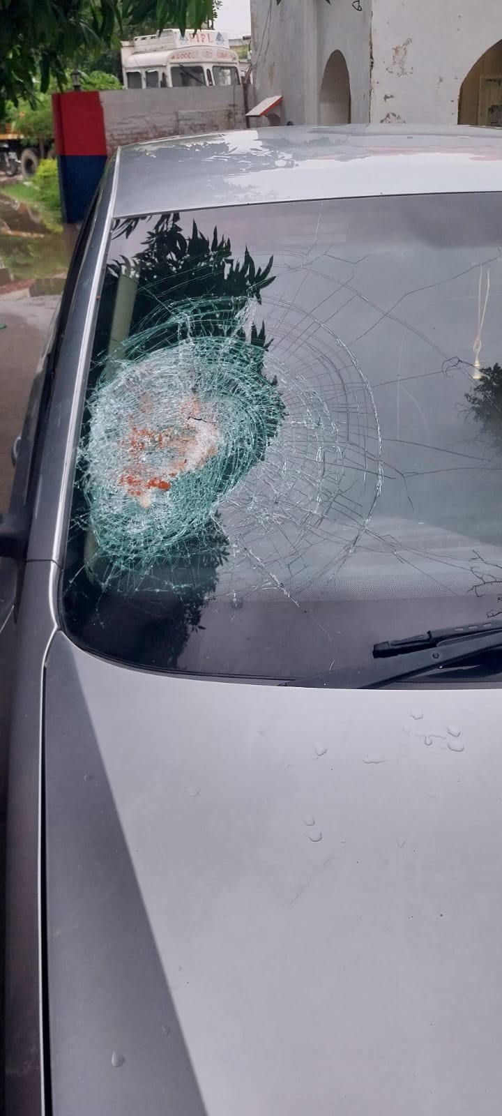 Miscreants smashed the car window with a brick.