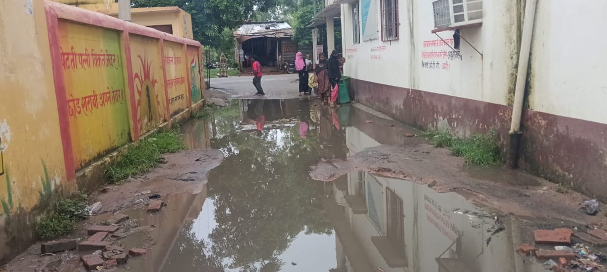 Rain exposes the reality of development; commuters struggle with waterlogging on roads.