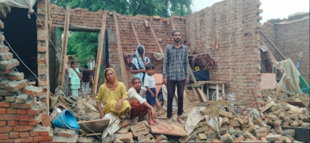 Two houses collapsed in the rain; widow seeks compensation.