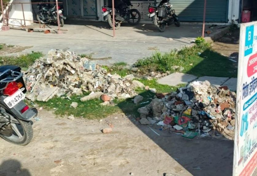 Piles of garbage scattered everywhere; people are troubled.