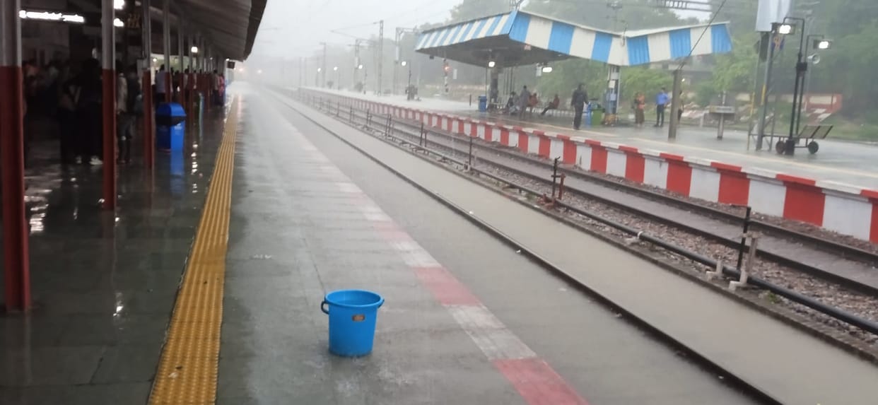Water accumulated at the railway station due to rain brought the tracks to the verge of submersion.