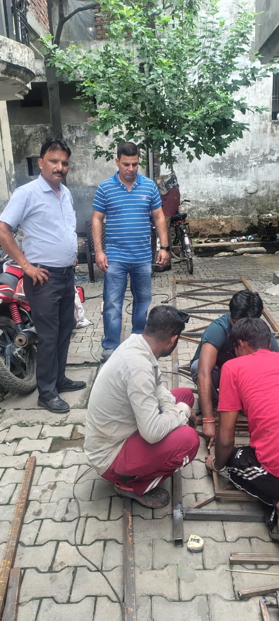 Grill being installed over the drain in Vijay Colony following the death of an innocent child