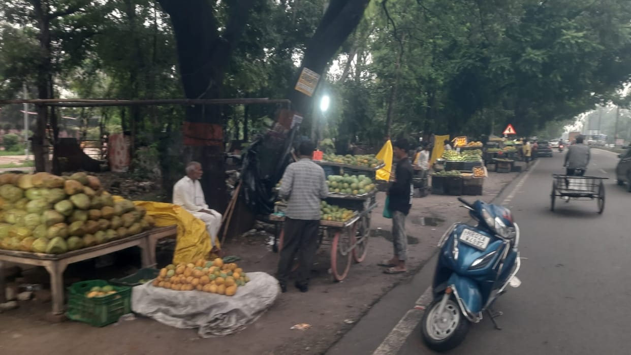 Shopkeepers encroach upon the footpath; risk of accidents looms on the road