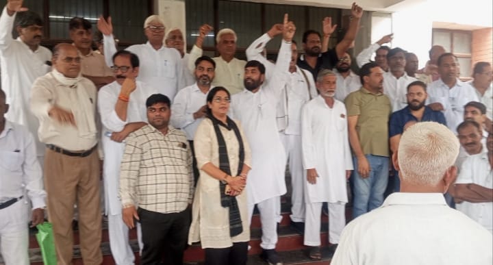 Congress stages sit-in protest against lathi-charge on students; demands Education Minister's resignation.