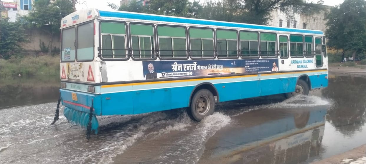 Bus stand turns into a pond; passengers in distress.