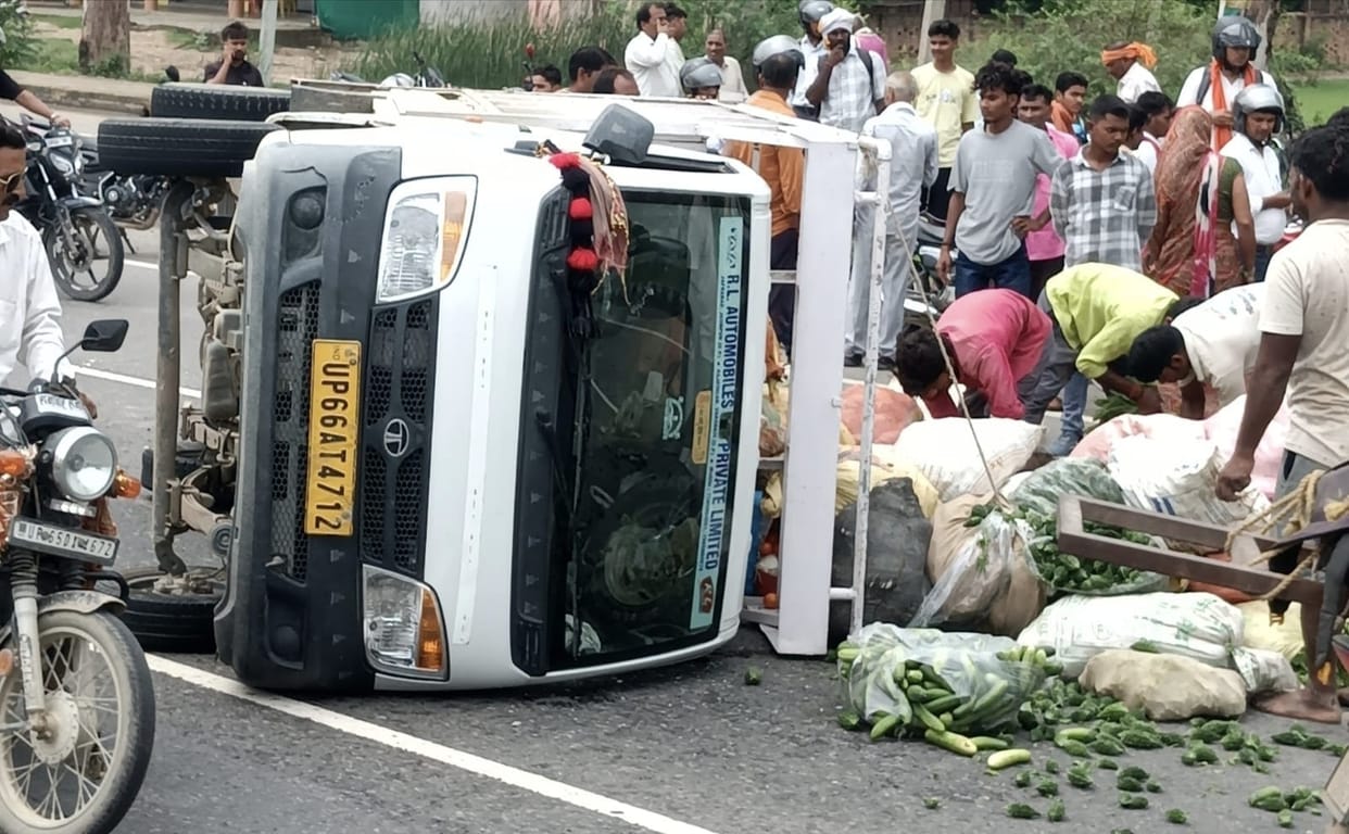 Vegetable-laden pickup overturns on highway after tyre burst; four injured.