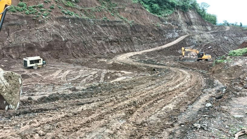 Debris from four-lane bypass excavation becomes a nuisance.