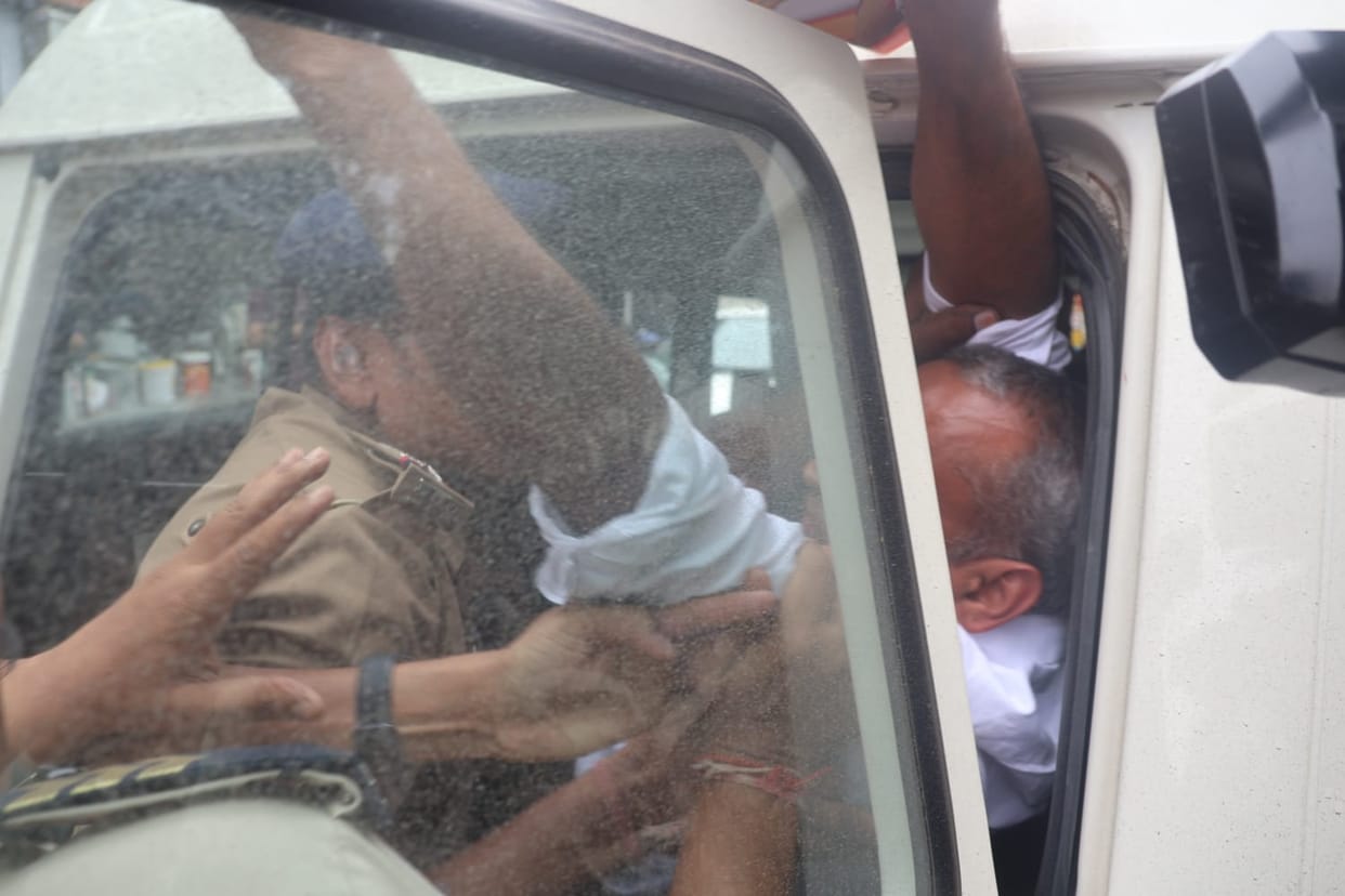 A couple detained after arriving at Minister Kailash Vijayvargiya's residence to protest.