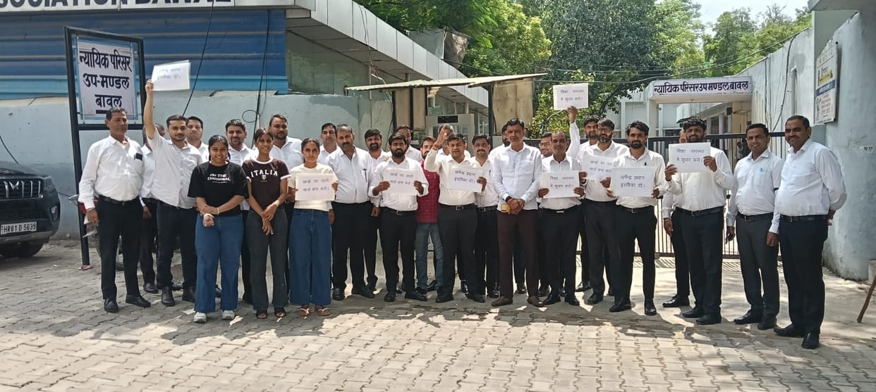 Lawyers hold road march in support of students, demand Education Minister's resignation.
