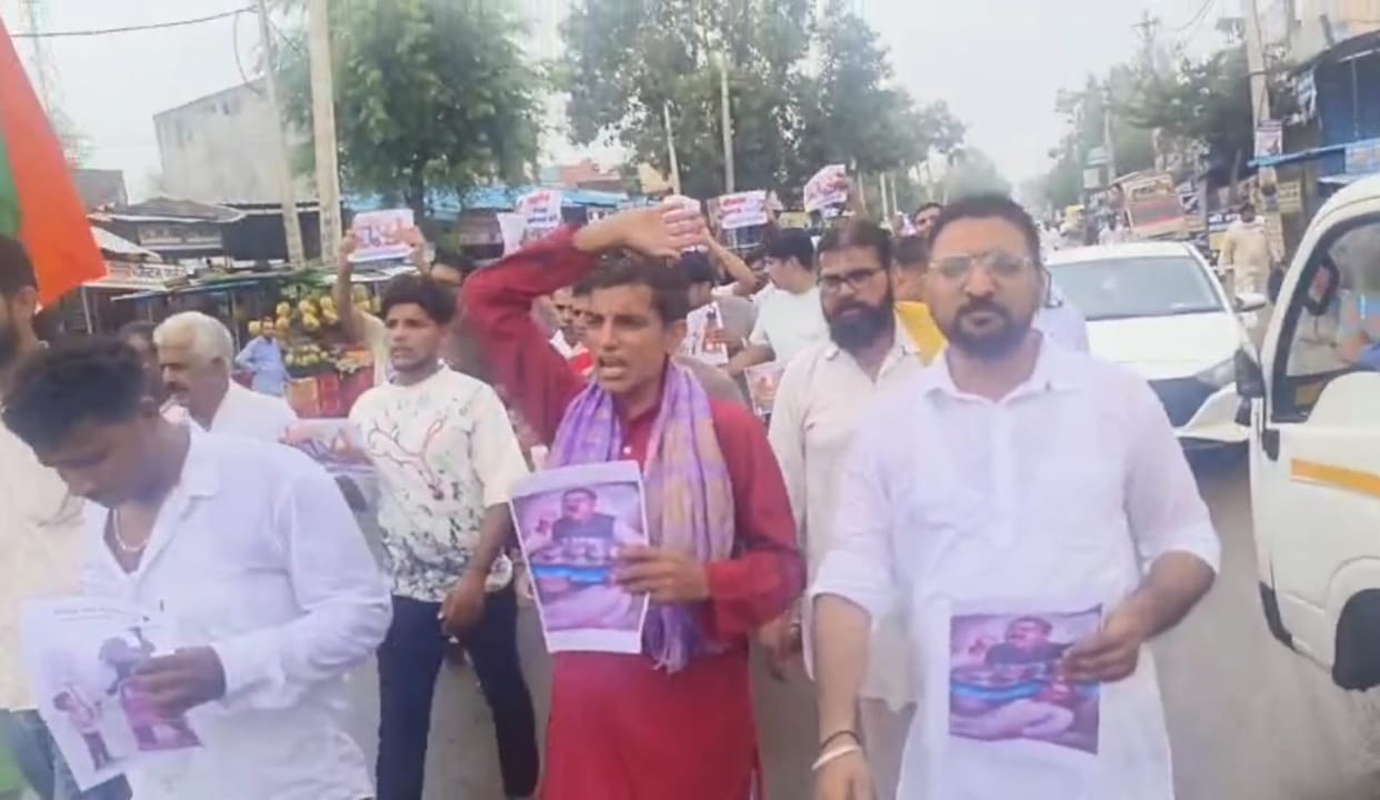 Protest march held at JUI demanding action against those responsible for the paper leak.