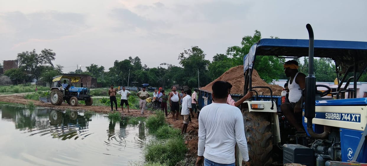 When no one listened, they built the dilapidated road themselves.