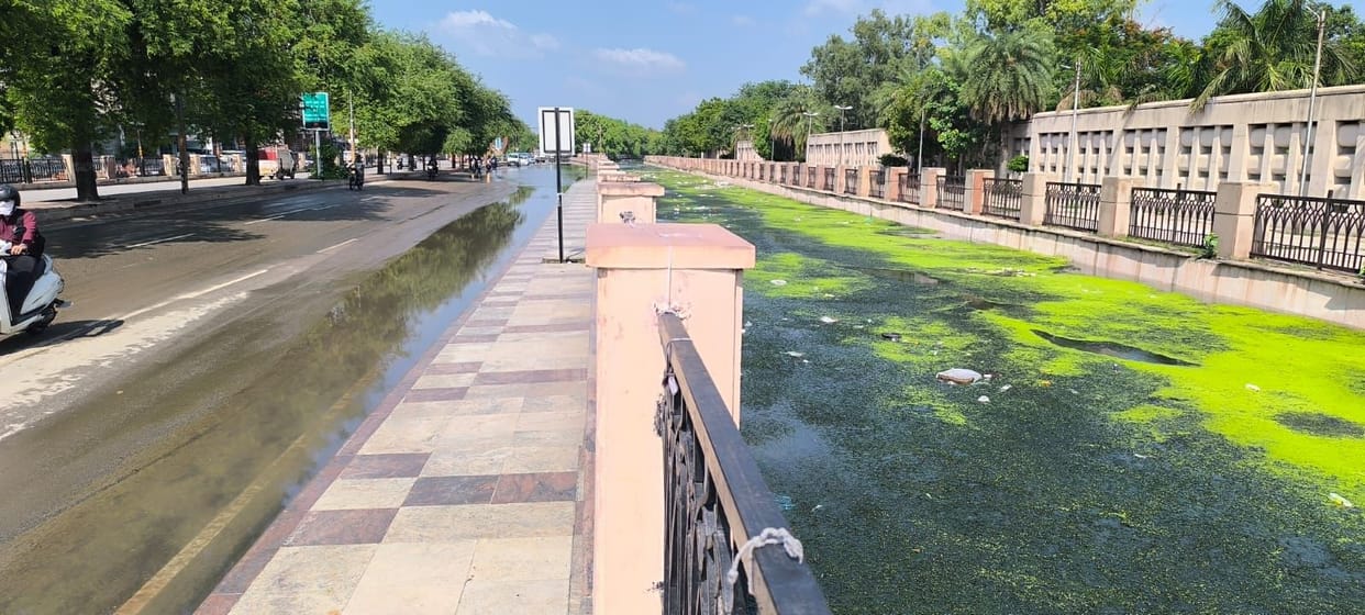 Canal overflows; road submerged even without rain.
