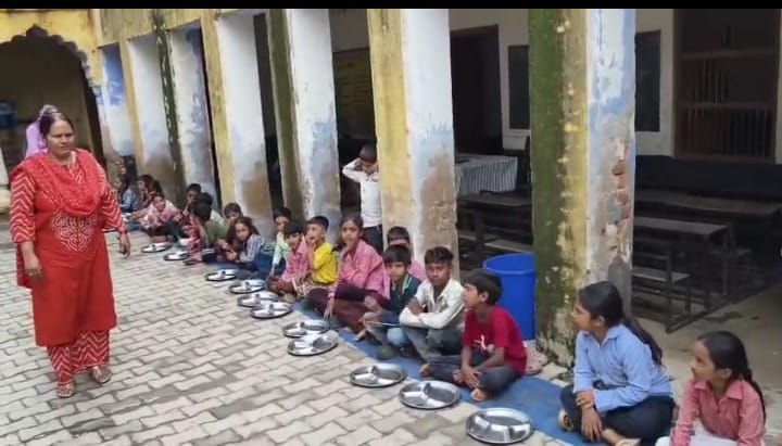 Children shaping their future in a dilapidated building; school awaits repairs.