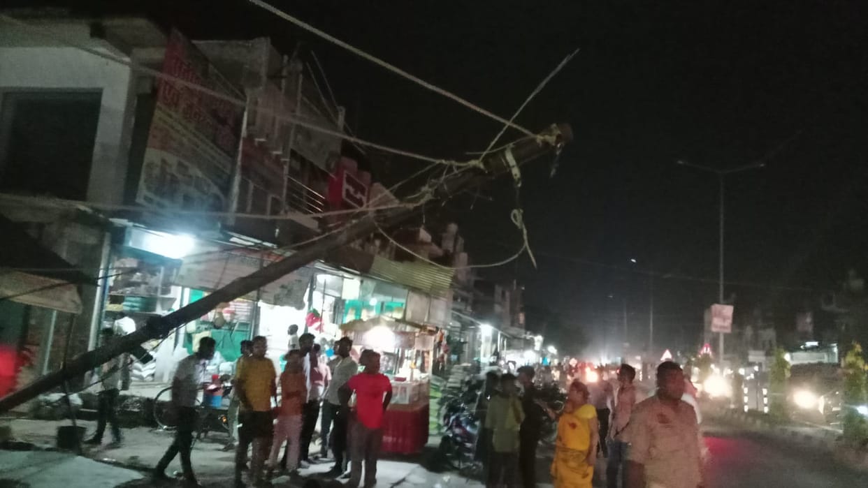 Electricity pole suddenly collapses; chaos ensues.