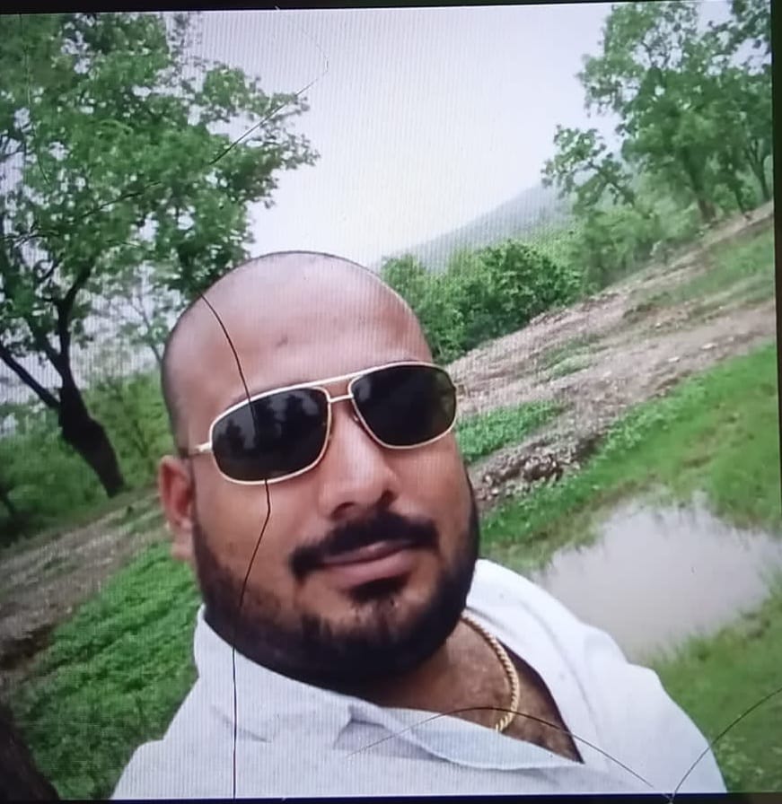 Contractor's body found hanging in the room; wife was sleeping in the other room.