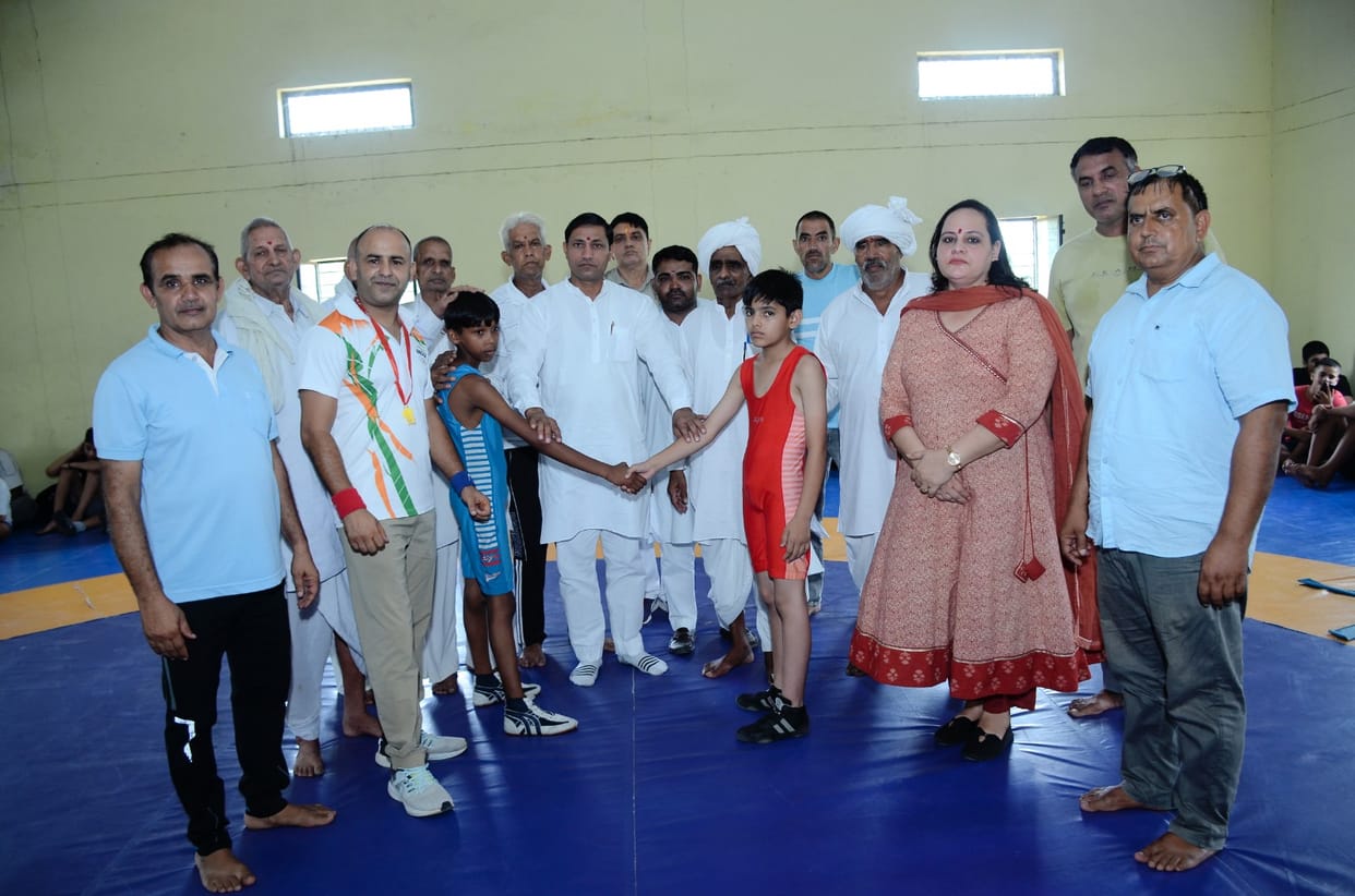 Aditya takes first place in Under-14 wrestling.