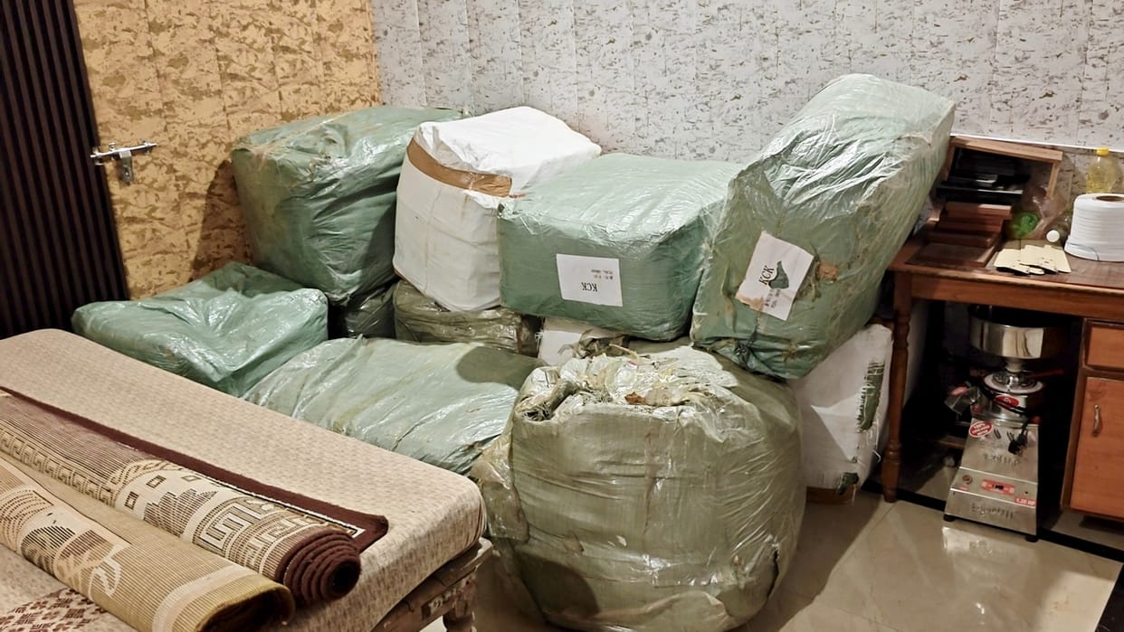 A consignment of hundreds of pairs of shoes and slippers was seized during a raid on the house.