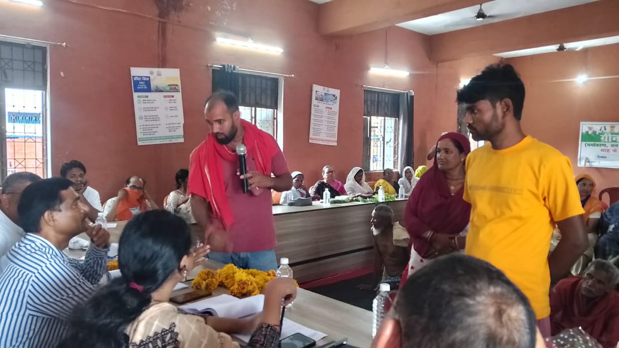 Issue of water drainage raised at village meeting; demand for drains and interlocking tiles voiced.